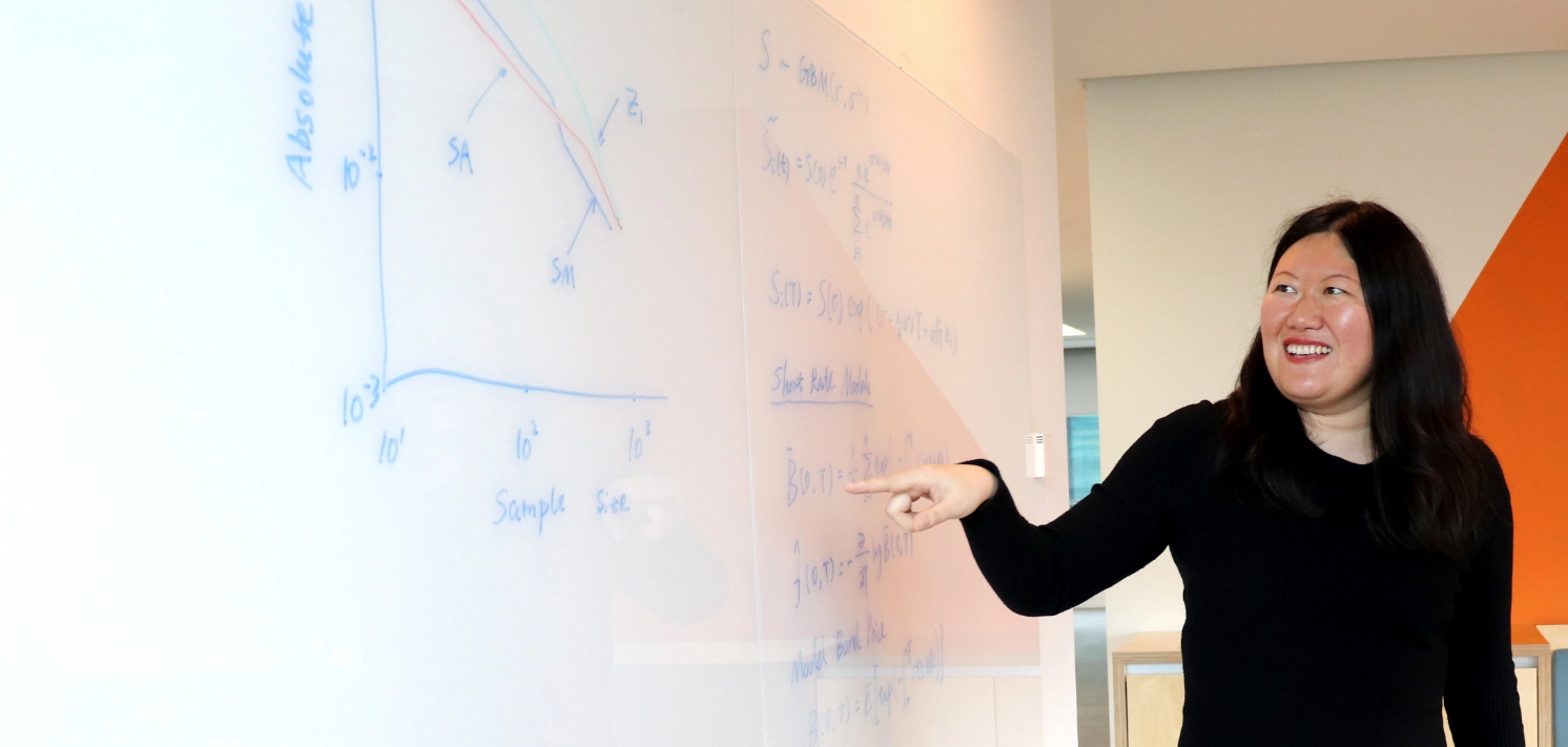 Employee teaching at a whiteboard
