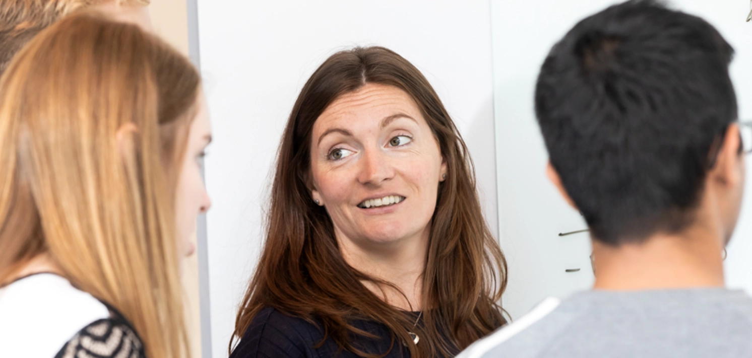 Employees having discussion at whiteboard