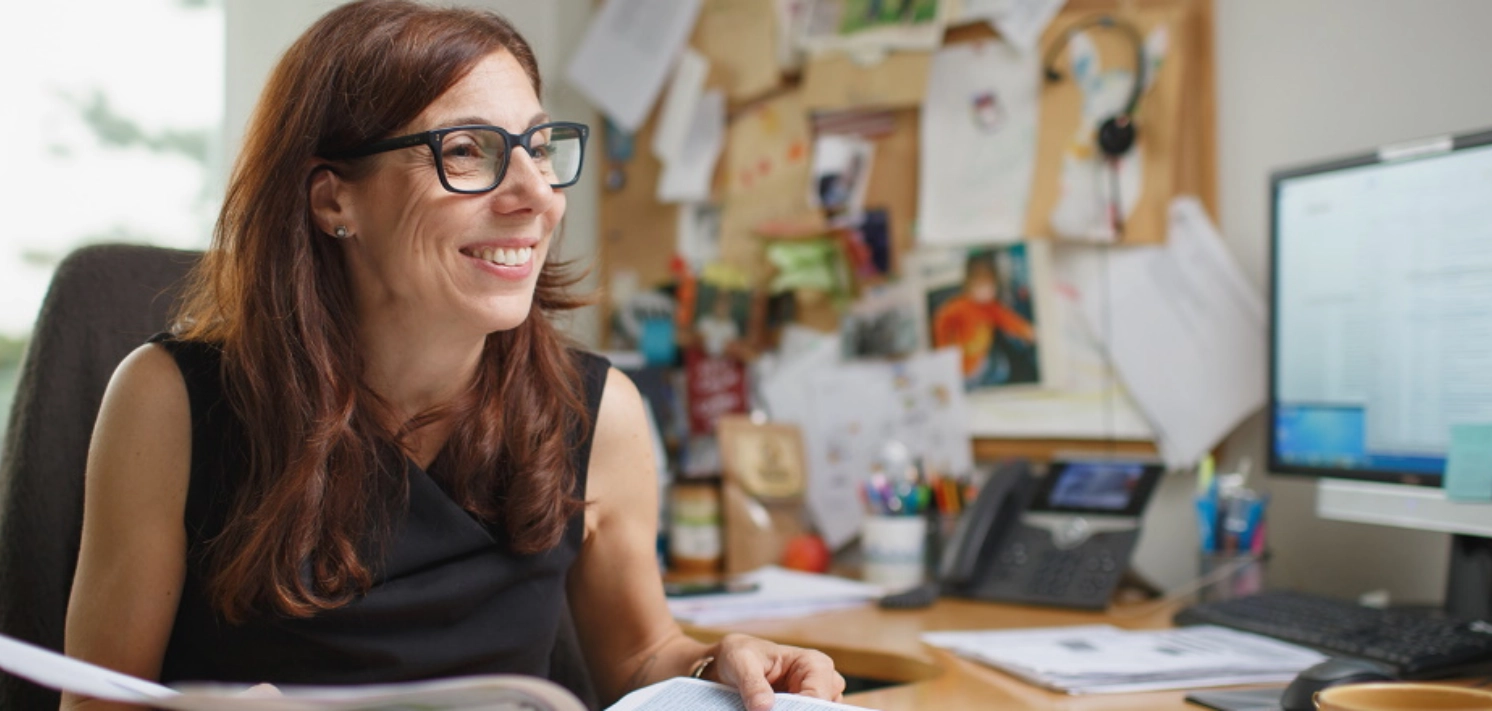 Photo of employee at desk